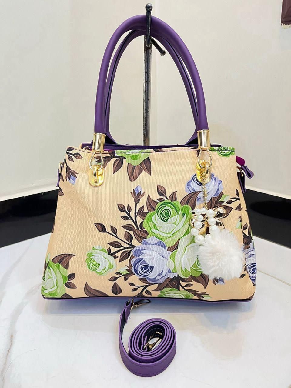 Elegant Floral Pattern Handbag with Stylish Handle and Charm Accent